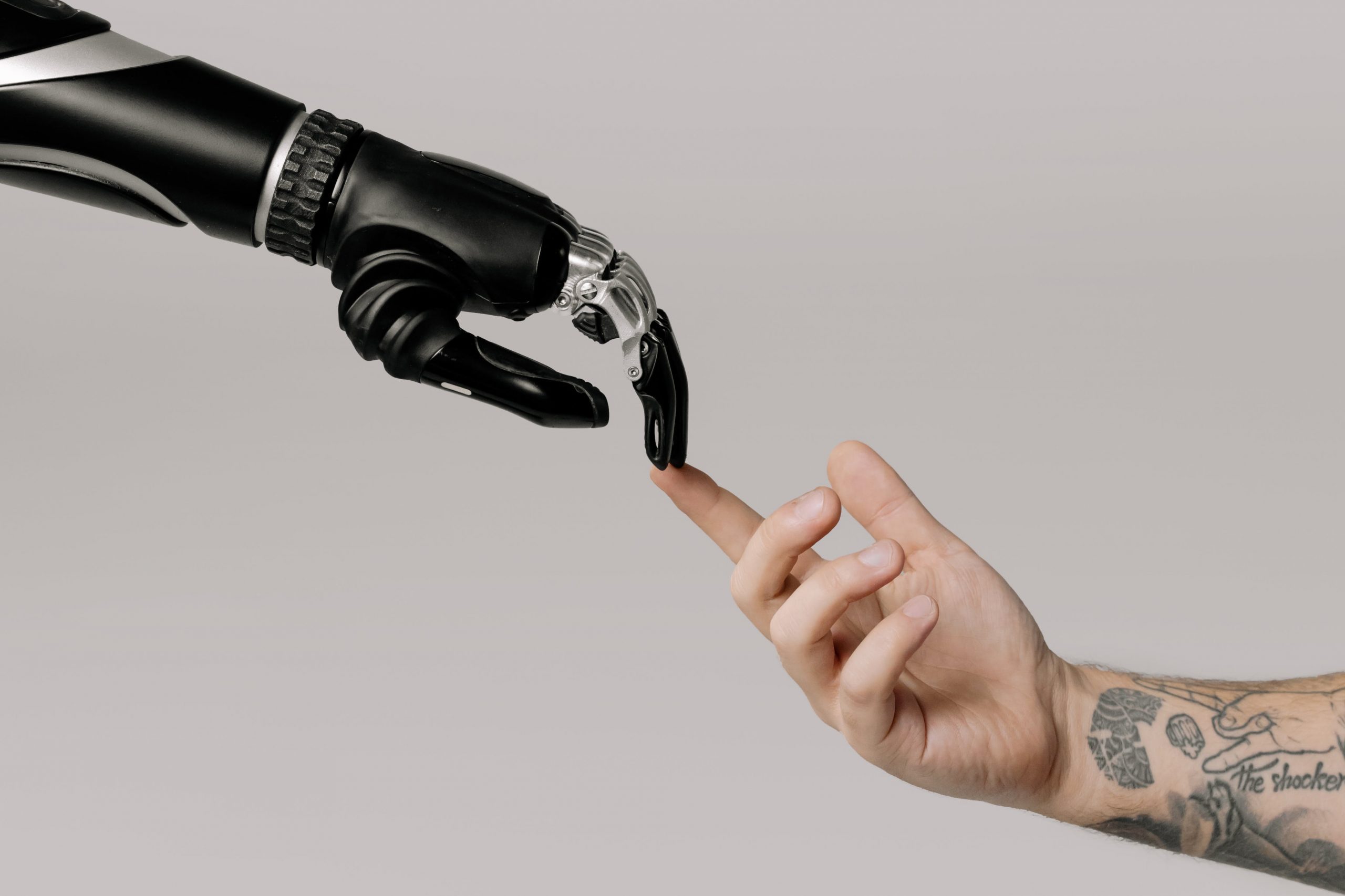 an AI hand touching a human hand